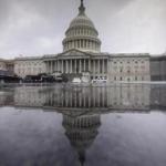 The Capitol is seen during a heavy rain in Washington, Friday, July 28, 2017. The White House and the Capitol sit two miles apart, but this week, they might as well have been two worlds away. Republicans labored over health care while White House officials labored to save their jobs amid a public - and sometimes shockingly vulgar - feud between senior staff. (AP Photo/J. Scott Applewhite)