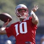 New England Patriots quarterback Jimmy Garoppolo (10) passes during NFL football training camp, Friday, July 28, 2017, in Foxborough, Mass. (AP Photo/Michael Dwyer)
