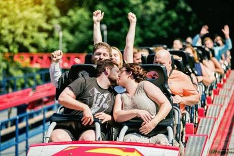 1rollercoasterwedding - Thom and Ashley Marchetti of North Kingstown, R.I., were married earlier this month on the Superman ride at Six Flags New England in Agawam. (handout)
