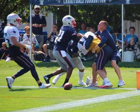 5 out 8 Julian Edelman and Stephon Gilmore fight at Patriots practice Tuesday, Aug. 1, 2017. (Shaun Ganley)
