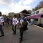People exited the commuter rail train to Foxborough.