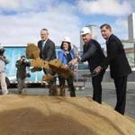 From left, Governor Charlie Baker, GE vice president Ann Klee, then-GE chief executive Jeff Immelt, and Mayor Martin J. Walsh participated at a groundbreaking for the new headquarters in Fort Point in May.