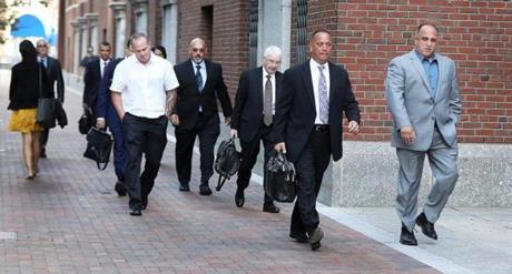 Defendants and attorneys arrived at the John Joseph Moakley United States Courthouse on Monday.
