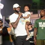 LeBron James held his daughter, Zhuri, during an event Tuesday in Sandusky, Ohio on Tuesday.