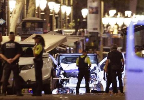 Police officers stood next to the van involved in an attack in Las Ramblas in Barcelona, Spain, on Thursday.
