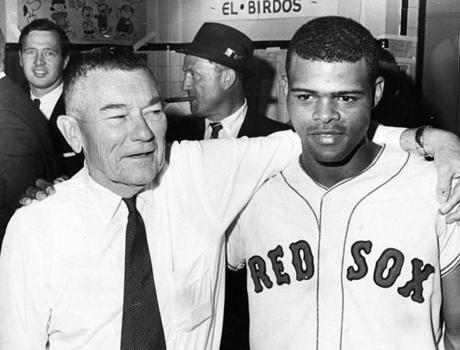 Boston, MA - 10/11/1967: Boston Red Sox owner Tom Yawkey, left, stands with Red Sox player Reggie Smith after the Red Sox defeated the St. Louis Cardinals in Game 6 of the World Series at Fenway Park in Boston on Oct. 11, 1967. The Red Sox forced a Game 7 by winning, 8-4. (Frank O'Brien/Globe Staff) --- BGPA Reference: 170322_MJ_041
