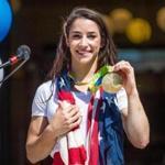08/27/2016 NEEDHAM, MA Aly Raisman (cq) shows the crowd her gold medal during a rally for Olympic champion gymnast in the Town Common of her hometown, Needham. (Aram Boghosian for The Boston Globe)
