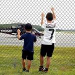 for 20namesChopper - Cody McKinstry, 10, of East Thetford, Vt., and his brother Kaleb, 5, watch a helicopter with the Trump name written on the side take off from the Lebanon Municipal Airport in West Lebanon, N.H., on Aug. 14, 2017. It was Cody's birthday and they were having lunch with their mother in their car near the airport control tower when they saw the helicopter land, refuel and take off in a half-hour. Cody asked the flight crew if the aircraft belonged to the President and they said yes. (Valley News - Geoff Hansen) Copyright Valley News. May not be reprinted or used online without permission. Send requests to permission@vnews.com.