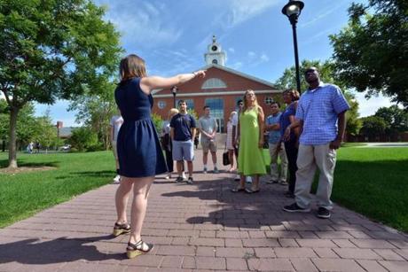 Junior Jackie Emmons of Boxford (left) led prospective students, including Cedane Richards of Hartford, Conn., (right, on a college tour at Bentley University.
