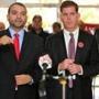 Felix G. Arroyo (left) was placed on paid administrative leave from his $130,000-a-year job in the administration of Mayor Martin J. Walsh (right) last month.