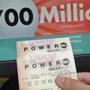 A customer showed her Powerball tickets for Wednesday's drawing on Tuesday in Hialeah, Fla. Because of a switch to lottery rules made in 2015, Powerball jackpots of late have been bigger than usual.