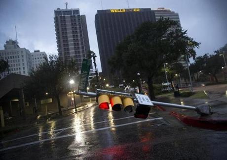 A damaged stop light blocks a street as Hurricane Harvey makes landfall in Corpus Christi, Texas, on Friday.
