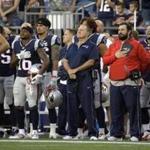 New England Patriots head coach Bill Belichick, center, and defensive coordinator Matt Patricia, second from right, stand with members of the team during the national anthem before an NFL preseason football game against the Jacksonville Jaguars, Thursday, Aug. 10, 2017, in Foxborough, Mass. (AP Photo/Steven Senne)