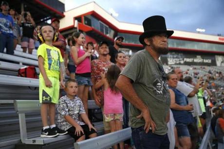 Bristol, TN -- 8/18/2017 - Warren Denney, a professional Abraham Lincoln impersonator, wore his hat as he stood to watch the cars take off for the Bass Pro Shops NRA Night Race Qualifying Race. (Jessica Rinaldi/Globe Staff) Topic: 21NASCAR Reporter: Annie Linskey
