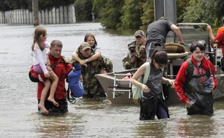 Houston residents were rescued from their homes Sunday.
