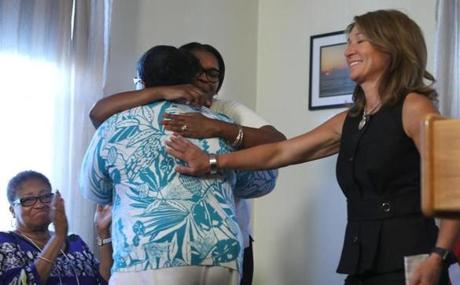 Boston, MA - 8/30/2017 - After Aretha Maugé (cq) (back to camera) spoke, she got a hug from Monalisa Smith (cq) and a hand from Lieutenant Governor Karyn Polito (cq). (Maugé lost her son, and Smith lost her nephew.) Eileen Paterson (cq) is at left. During a press conference at Gavin Foundation's Devine Recovery Center (cq), Governor Charlie Baker (cq), and others, announce a public safety legislation reform package. Photo by Pat Greenhouse/Globe Staff Topic: 31safety Reporter: Jan Ransom
