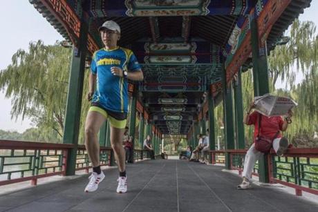 Wang Le on Friday trained at Longtanhu Park in Beijing for the Beijing marathon. Wang, a Beijing running app developer, has ran Boston four times.
