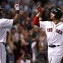 Boston, MA: September 12, 2017: Hanley Ramirez (left) greets teammate Mookide Betts (right) after his bottom of the fourth inning two run home run put Boston ahead 7-1. The Boston Red Sox hosted the Oakland Athletics in a regular season MLB baseball game at Fenway Park. (Jim Davis/Globe Staff). 