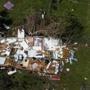 This aerial photo shows a damaged structure in Immokalee, Fla., on Saturday, Sept. 16, 2017, six days after Hurricane Irma. (Nicole Raucheisen/Naples Daily News via AP)
