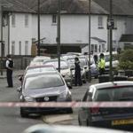 Police officers blocked off a road Saturday in Sunbury-on-Thames, southwest London.