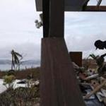 Cruz Bay, St. John -- 9/14/2017 - William de Leon sorts through the remnants of an office on Estate Lindholm destroyed by Hurricane Irma, a hotel in the Cruz Bay section of St. John. (Jessica Rinaldi/Globe Staff) Topic: Reporter: 