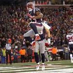 Foxborough, MA 01/14/17 New England Patriots running back Dion Lewis (33) celebrates his fourth quarter touchdown with a leaping spike. The New England Patriots play against the Houston Texans in the AFC Divisional Playoff game at Gillette Stadium Saturday, Jan. 14, 2017. (Barry Chin/Globe Staff