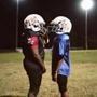 Marshall Longhorns football players during a break from practice in Marshall, Texas, Oct. 20, 2016. Tackle football is making a comeback among Marshall youths, despite the well-known safety risks associated with playing at such a young age. (Brandon Thibodeaux/The New York Times)