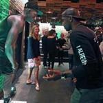 Boston, MA: September 21, 2017: Boston Celtics guard Kyrie Irving is pictured at the Celtics Nike jersey release event held at the Committee restaurant on Northern Avenue. He was having some fun trying to imitate and get a reaction from a human mannequin (left), who was posing in his new number 11 jersey at the event. (Jim Davis/Globe Staff). 