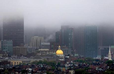Cambridge 06/0514- Fog shrouds the Boston skyline as the State House dome stands out amidst the buildings on Beacon Hill as seen from Cambridge. Boston Globe staff photo by John Tlumacki (metro)
