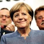 BERLIN, GERMANY - SEPTEMBER 24: German Chancellor and Christian Democrat (CDU) Angela Merkel smiles while thanking supporters at CDU headquarters at the end of the election evening following federal elections results that give the CDU 33% of the vote, giving it a first place finish, though 8.5% less than in the last election four years ago, on September 24, 2017 in Berlin, Germany. Chancellor Merkel is seeking a fourth term and coming weeks will likely be dominated by negotiations between parties over the next coalition government. The right-wing Alterniative for Germany (AfD) finished in the third place with a better-than-expected 13.2%. (Photo by Sean Gallup/Getty Images)