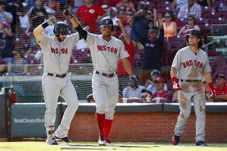 Boston Red Sox's Mookie Betts reacts after hitting the game-tying three-run double off Cincinnati Reds relief pitcher Raisel Iglesias in the eighth inning of a baseball game, Sunday, Sept. 24, 2017, in Cincinnati. The Red Sox won 5-4. (AP Photo/John Minchillo)
