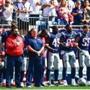 FOXBORO, MASSACHUSETTS - SEPTEMBER 24: Head coach Bill Belichick looks on as members of the New England Patriots kneel on the sidelines as the National Anthem is played before a game against the Houston Texans at Gillette Stadium on September 24, 2017 in Foxboro, Massachusetts. (Photo by Billie Weiss/Getty Images)