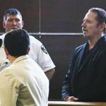 Actor Tom Wopat (right) stood during his arraignment last month.