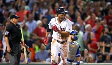 Boston, MA: September 27, 2017: The Red Sox Xander Bogaerts tosses away his bat as he watches the flight of his bottom of the third inning three run home run. The Boston Red Sox hosted the Toronto Blue Jays in an MLB regular season baseball game at Fenway Park. (Jim Davis/Globe Staff). 
