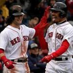 Boston, MA - 9/30/2017 - (5th inning) Boston Red Sox left fielder Andrew Benintendi (16) greets Boston Red Sox right fielder Mookie Betts (50) at home plate after both scored on a double by Boston Red Sox first baseman Mitch Moreland (18) during the fifth inning. The Boston Red Sox host the Houston Astros at Fenway Park. - (Barry Chin/Globe Staff), Section: Sports, Reporter: Peter Abraham, Topic: 01Red Sox-Astros, LOID: 8.3.3843085008.