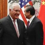 US Secretary of State Rex Tillerson (left) walked by Chinese Foreign Minister Wang Yi before a meeting at the Great Hall of the People in Beijing on Saturday.