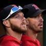 Boston, MA - 10/01/2017 - (9th inning) Boston Red Sox starting pitchers Chris Sale and Rick Porcello look out from the dugout as the final out is made in the regular season home game. Sale will make his debut in the postseason at Houston in Game 1 of the ALDS. The Boston Red Sox host the Houston Astros at Fenway Park in the final game of the regular season. - (Barry Chin/Globe Staff), Section: Sports, Reporter: Peter Abraham, Topic: 02Red Sox-Astros, LOID: 8.3.3874377436.