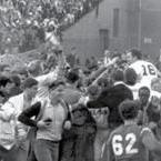 Red Sox pitcher Jim Lonborg was swept away by excited fans after Boston defeated the Minnesota Twins to clinch at least a tie for the American League pennant.