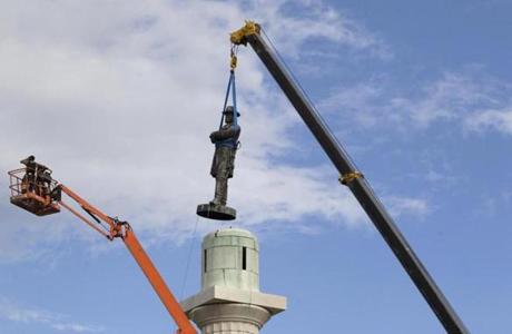 A statue of Confederate General Robert E. Lee is removed from Lee Circle in New Orleans earlier this year. 
