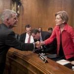 Wells Fargo CEO and president Timothy Sloan shook hands with US Senator Elizabeth Warren before the start of Tuesday?s Senate Banking, Housing, and Urban Affairs Committee hearing. Their subsequent exchange during the hearing would not be so cordial.