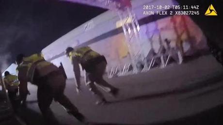 A frame grab taken from a bodycam video released by the Las Vegas Metropolitan Police Department (LVMPD) shows officers responding to the mass shooting at the Route 91 Harvest festival near Mandalay Bay hotel on Las Vegas Boulevard in Las Vegas, Nev.
