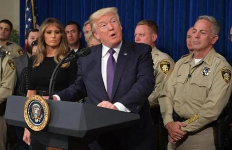 President Donald Trump spoke as First Lady Melania Trump (left) looked on as he visited the Metropolitan Police Department command centre in Las Vegas, Nev. on Wednesday.
