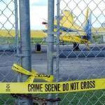 The crop-dusting airplane that 9/11 terrorist Mohamed Atta once allegedly tried to rent sat idle behind police tape Sept. 24, 2001, on a Belle Glades, Fla., airfield. 