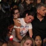 Mourners reacted at a vigil for Las Vegas victims Monday.