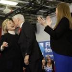 Democratic presidential candidate Hillary Clinton, former President Bill Clinton and their daughter Chelsea Clinton embrace, at her first-in-the-nation presidential primary campaign rally, Tuesday, Feb. 9, 2016, in Hooksett, N.H. (AP Photo/Matt Rourke)