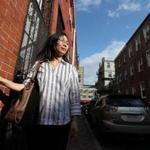 Mei Qun Huang stood near her former apartment on Johnny Court, which she heard was now being used as a short-term rental.
