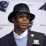 FILE - In this Oct. 1, 2017, file photo, Carolina Panthers quarterback Cam Newton speaks to the media following an NFL football game against the Carolina Panthers, in Foxborough, Mass. Dannon, the maker of Oikos yogurt, is cutting ties with spokesman Cam Newton following what the company perceives as ?sexist? comments the Carolina quarterback made to a female reporter. (AP Photo/Steven Senne, File)