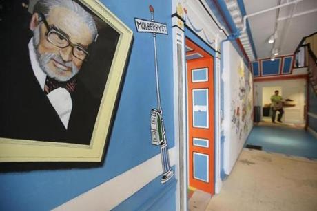A mural that featured Theodor Geisel, left, also known by his pen name Dr. Seuss, rested on a wall near an entrance at The Amazing World of Dr. Seuss Museum, in Springfield, in May. 
