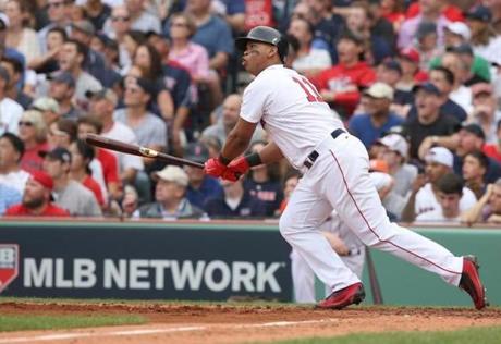 BOSTON, MA 10/08/2017 Red Sox Rafael Devers hits a two-run home run in the third inning. The Boston Red Sox host the Houston Astros in Game Three of the ALDS at Fenway Park in Boston on Oct. 8, 2017. (Barry Chin/Globe Staff) 
