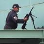 Boston-10/08/17-Red Sox vs Astros Game 3 Division Series- A member of the Boston Police SWAT team positions a high-powered gun on the roof above the first base stands as security has been tightened since the Las Vegas shooting. John Tlumacki/Globe Staff(sports)